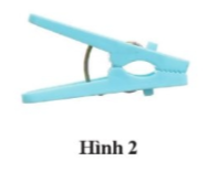 Em hãy mô tả cách mở chiếc kẹp ở hình 2. Sau đó, biểu diễn lực tác dụng và chỉ rõ đâu là điểm tựa.