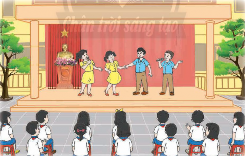 Tham gia và cổ vũ các tiết mục văn nghệ theo chủ đề "Em là học sinh thân thiện". Chia sẻ cách thực hiện những việc em cần làm trong tháng hành động